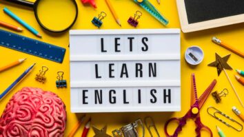 sign that reads "let's learn English"