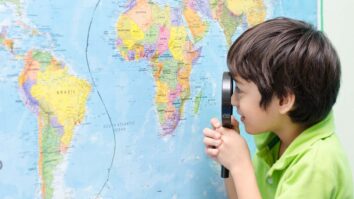 boy map magnifying glass